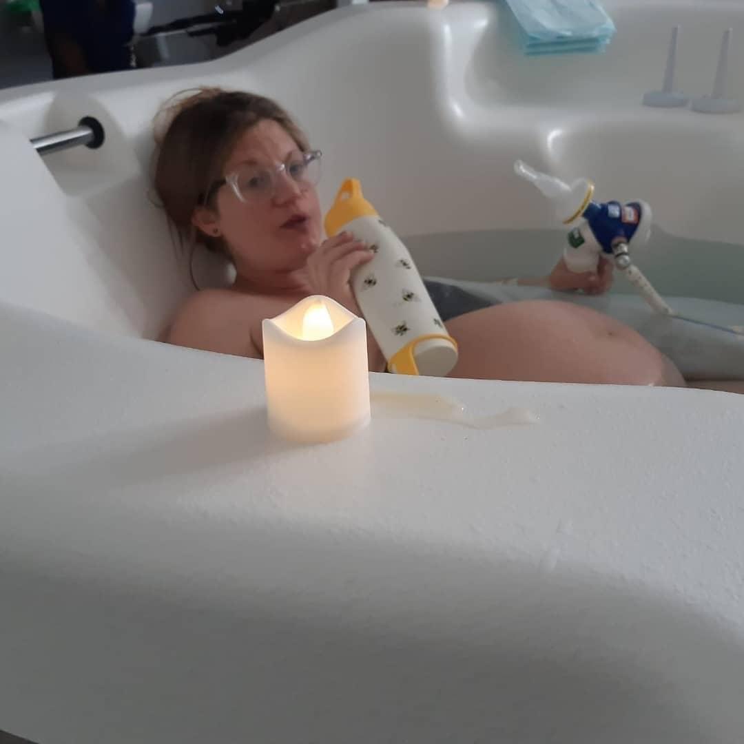 Aimee in birthing pool during labor